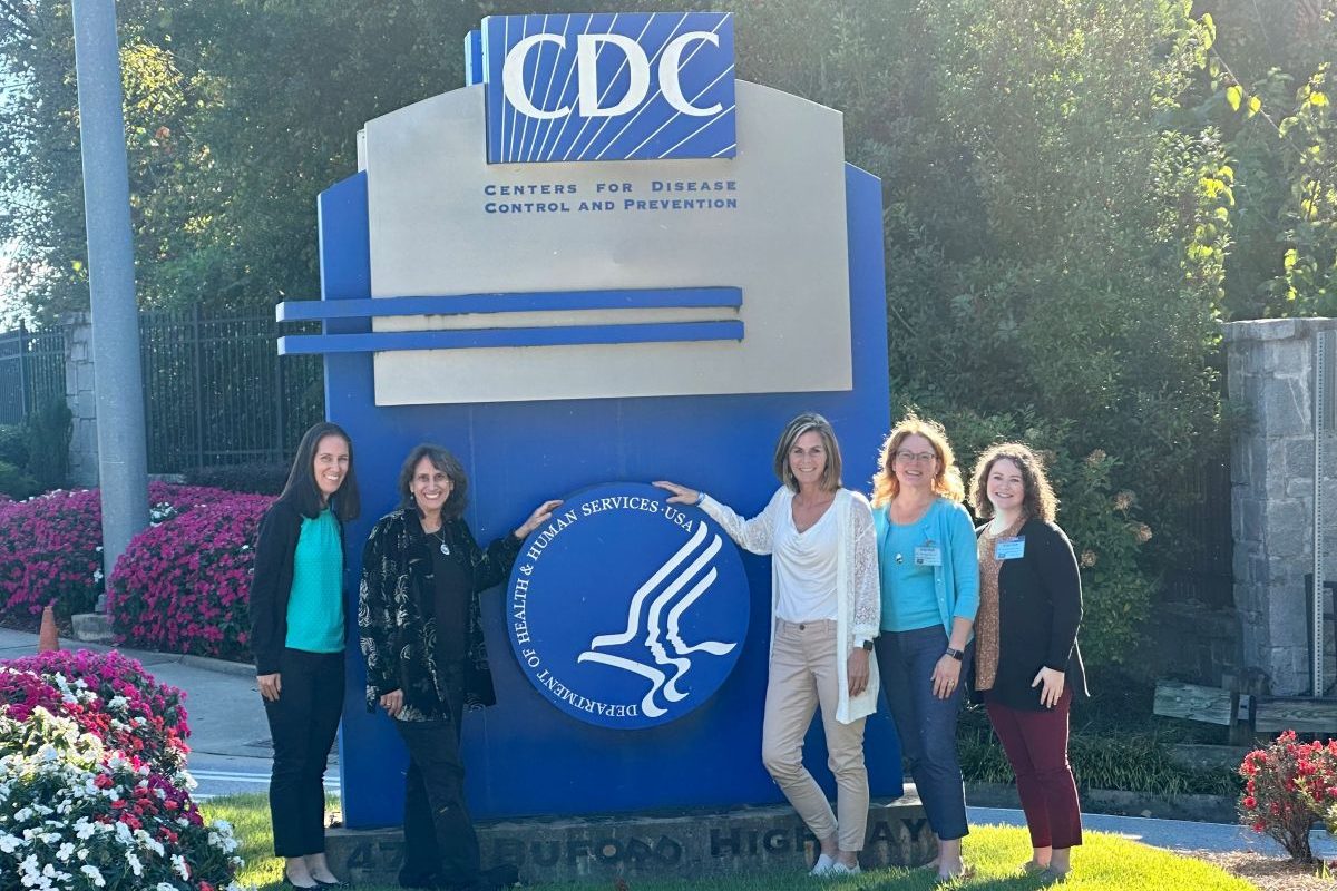 CT WSCC team members in front of a sign saying CDC