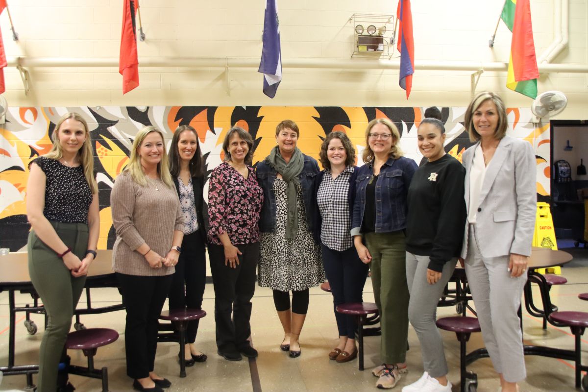 CT WSCC team members, representatives from the CDC, and East Hartford public school staff stand in a classroom