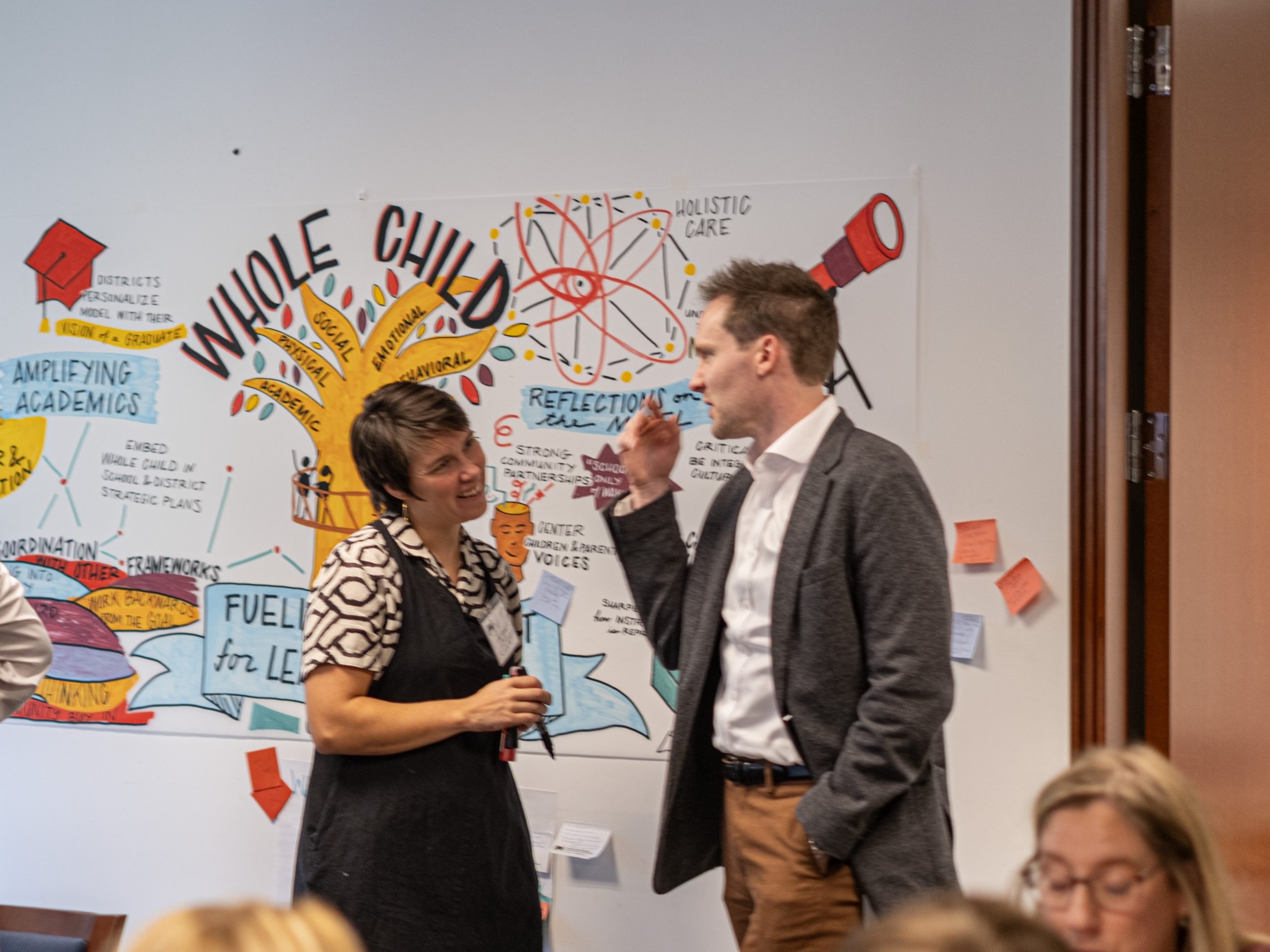 Visual artist chats with a Convening participant